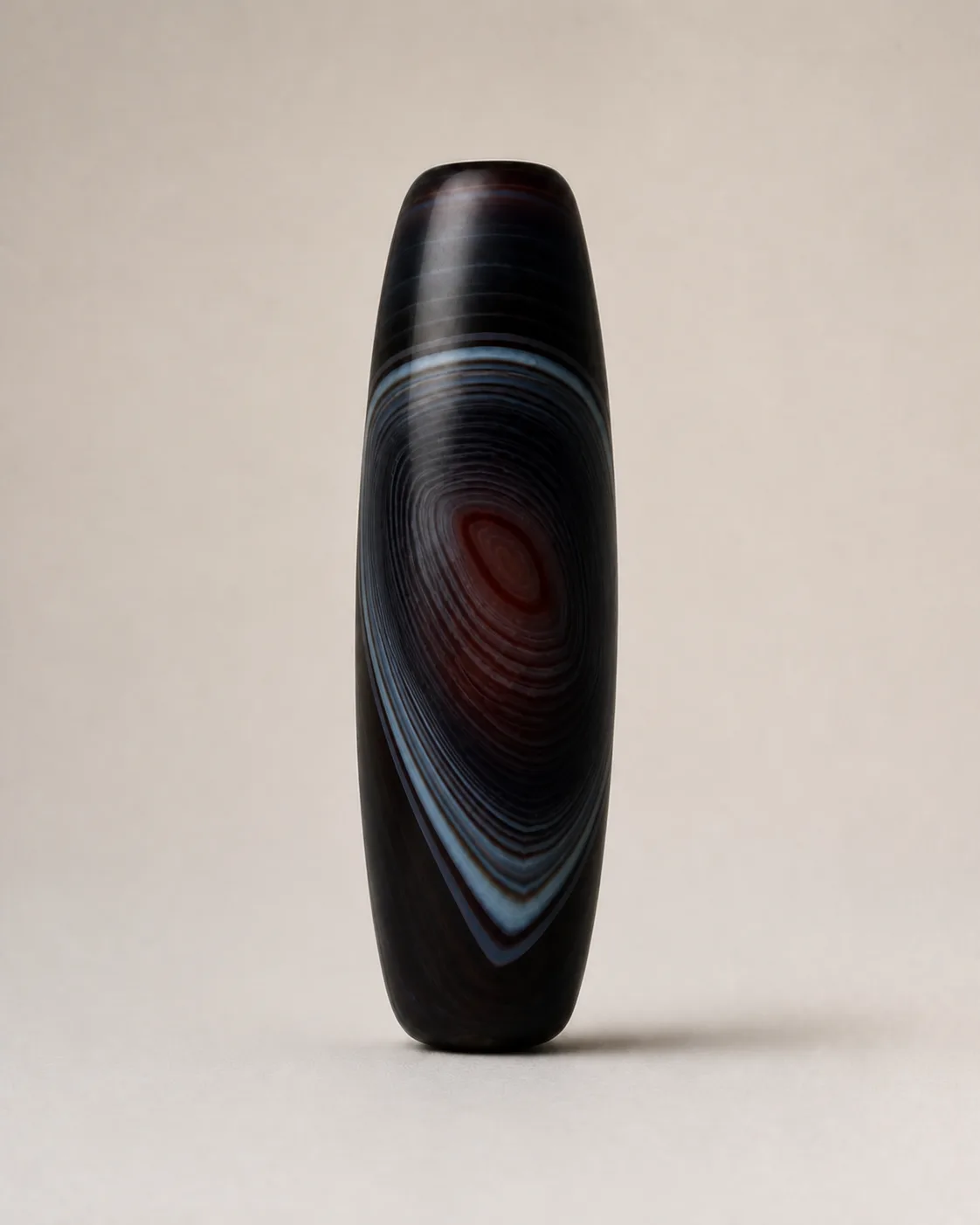 Dark Nested-Chevron Dzi Bead | Front